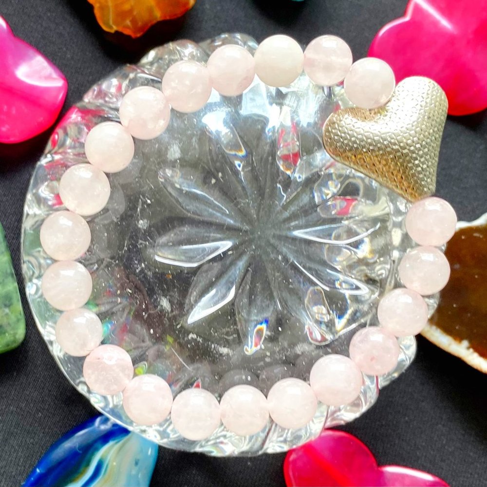 Rose Quartz precious stones with a silver in color HEART Bracelet